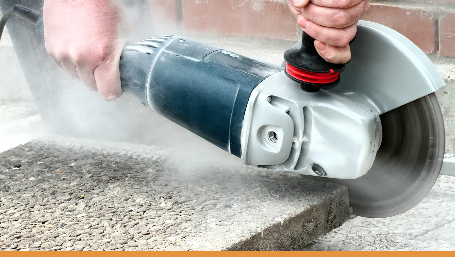 An angle grinder cutting concrete.